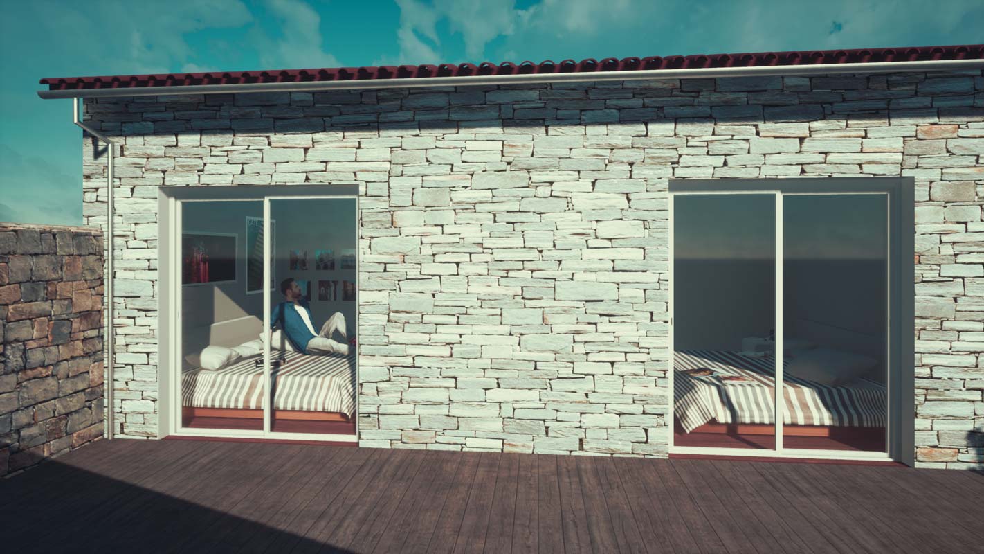 Mur de pierres de parement d'une maison de vacances sur l'Ile de Ré avec terrasse en bois
